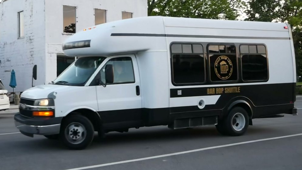 The Jville Brew Loop shuttle parked on a street in downtown Jacksonville